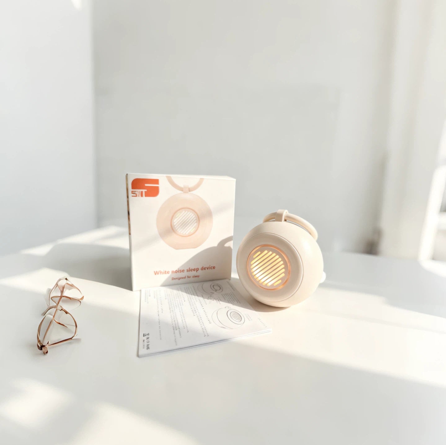 White electronic device with packaging on a light surface